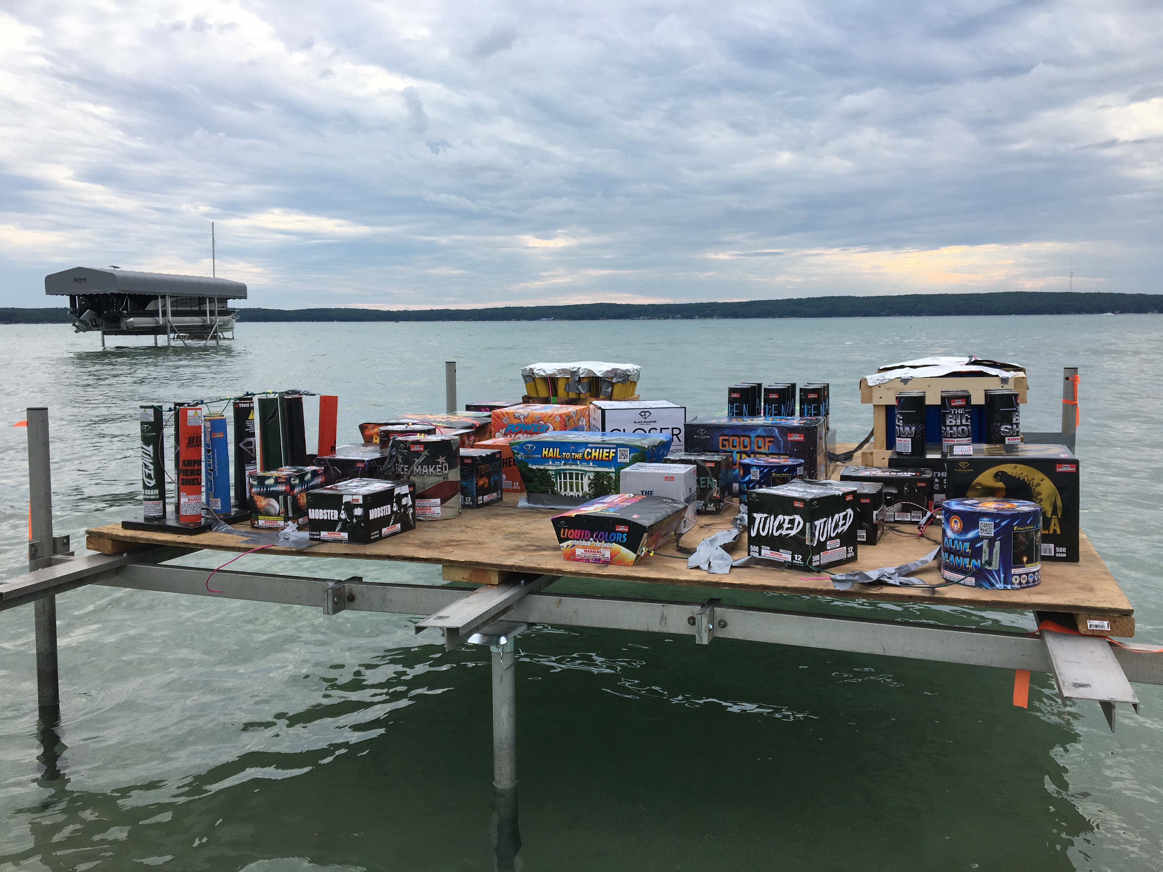 Fireworks shells staged on a dock over the lake before the show